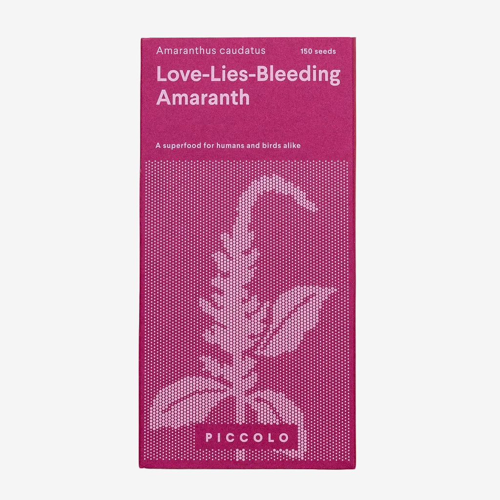 Pink seed packet for 'Love-Lies-Bleeding Amaranth' with botanical illustration on a beige background