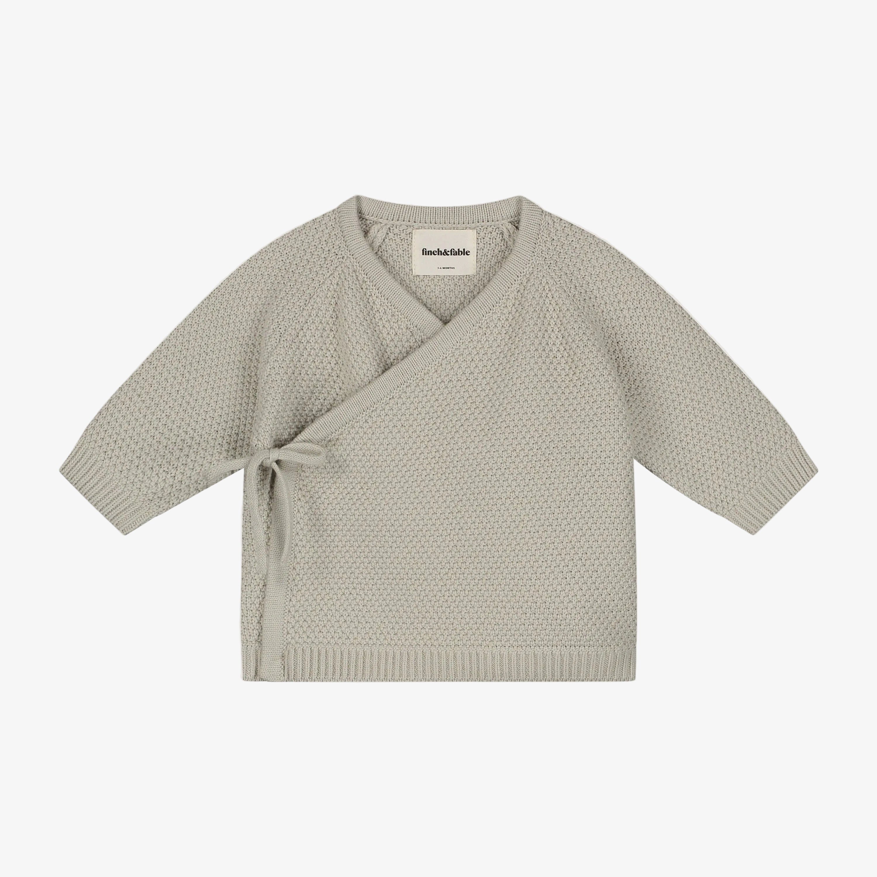 Light gray knit cardigan on a light gray background