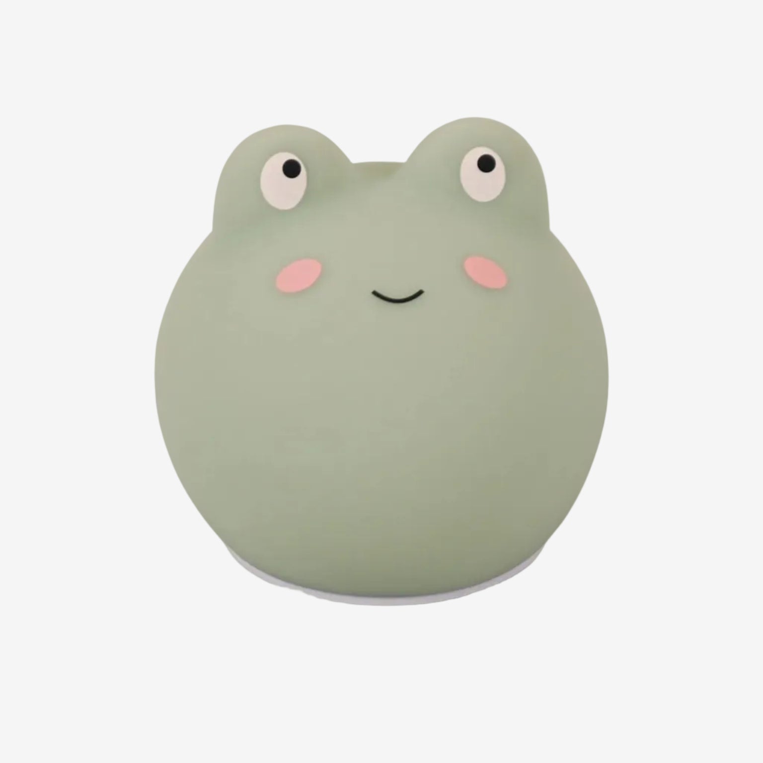 Green frog-shaped night light on a white background