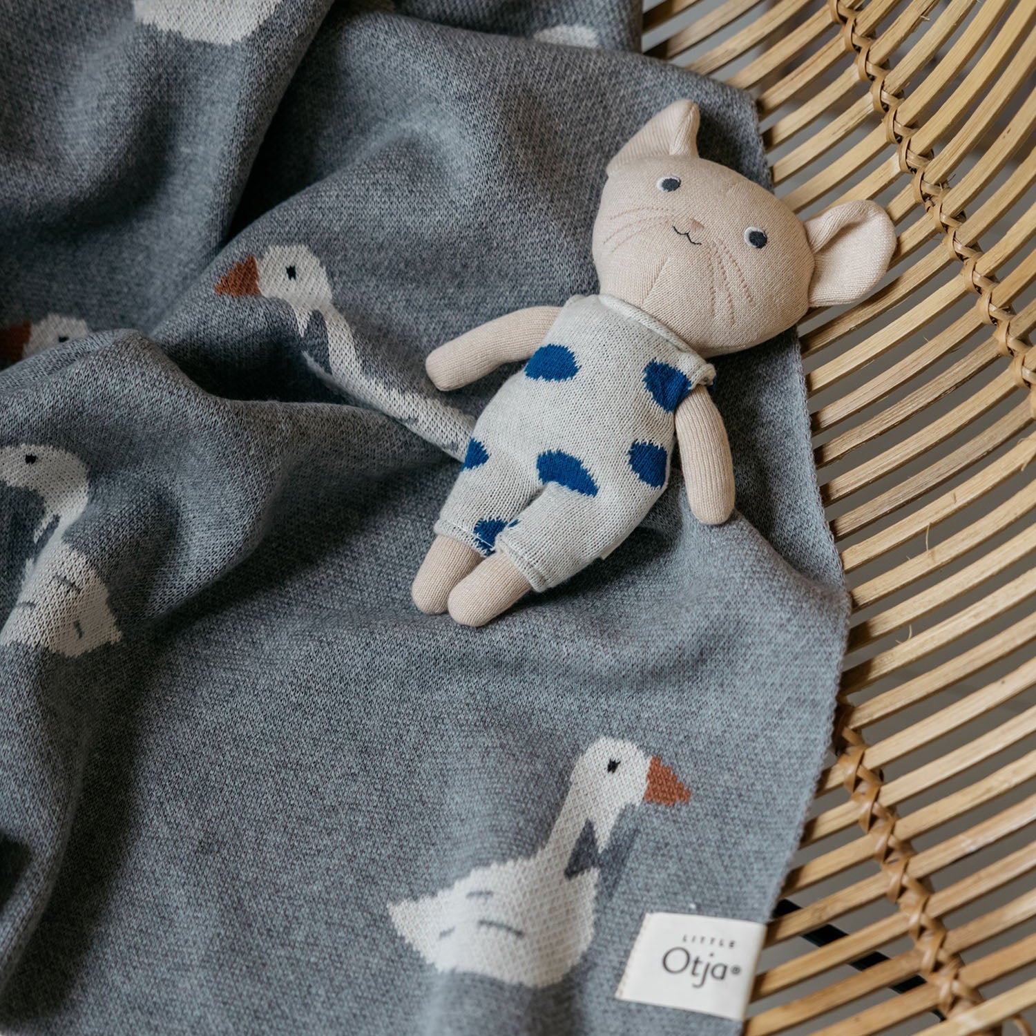 little otja mouse toy on a goose blanket