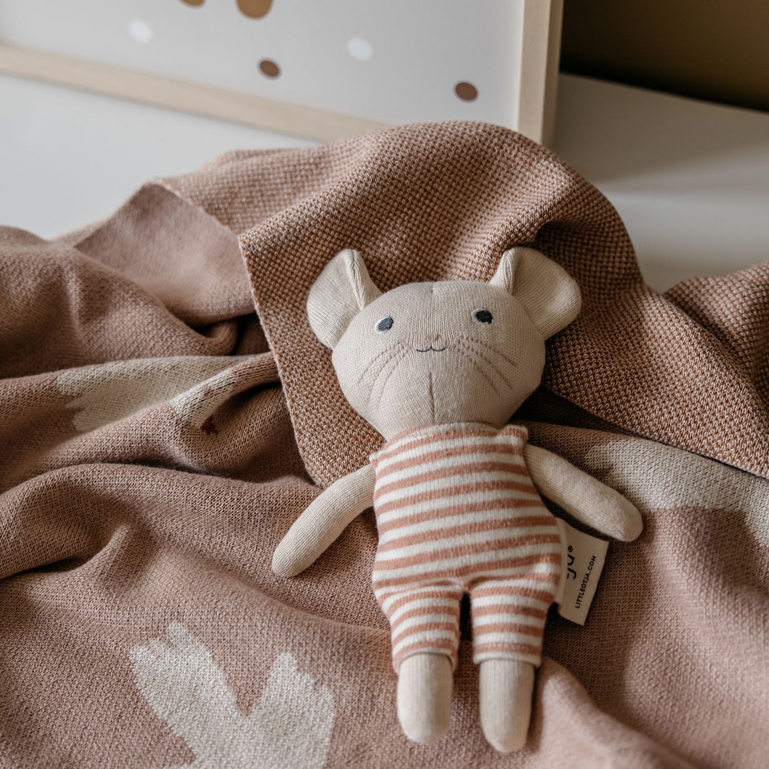 little otja kids room mouse toy on a baby blanket