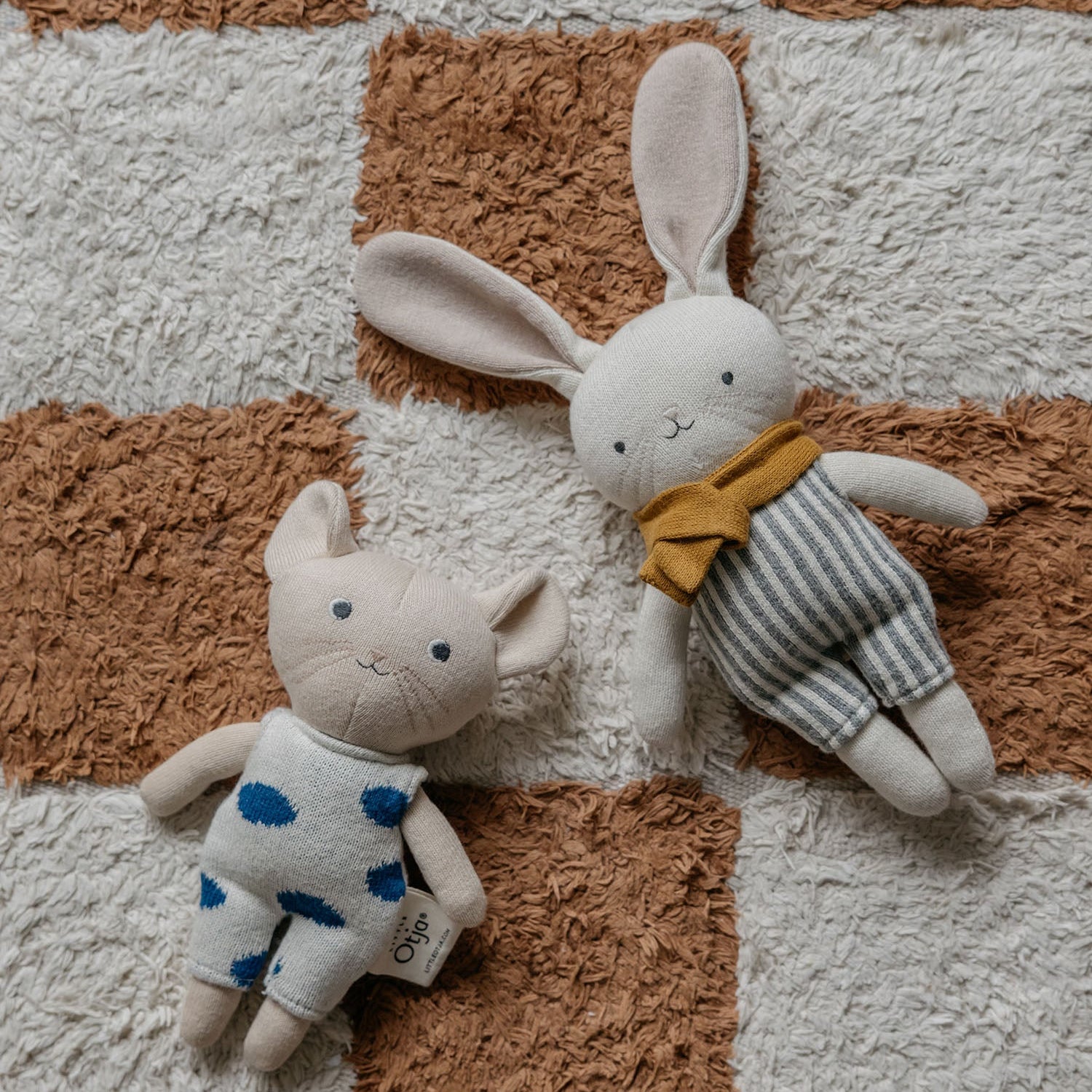 little otja mouse and rabbit toy on the carpet