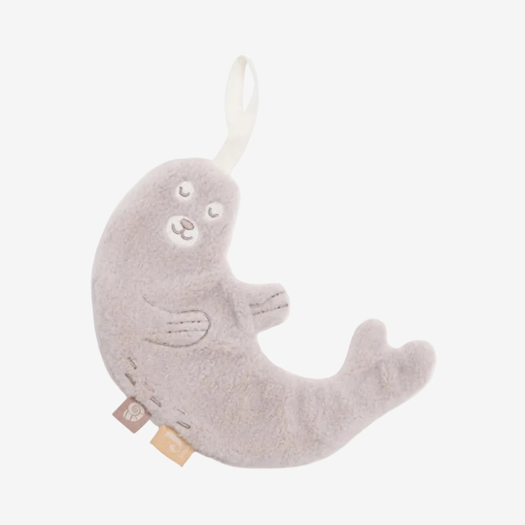 Gray plush toy shaped like a seal on a white background