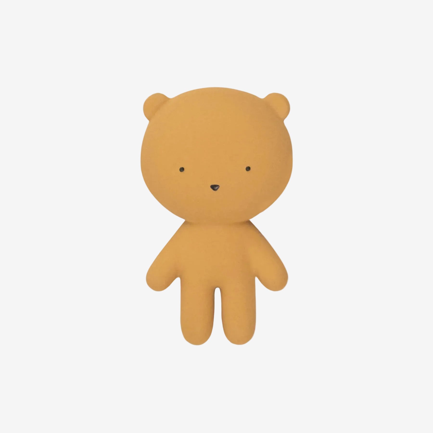 Small mustard yellow bear toy on a white background