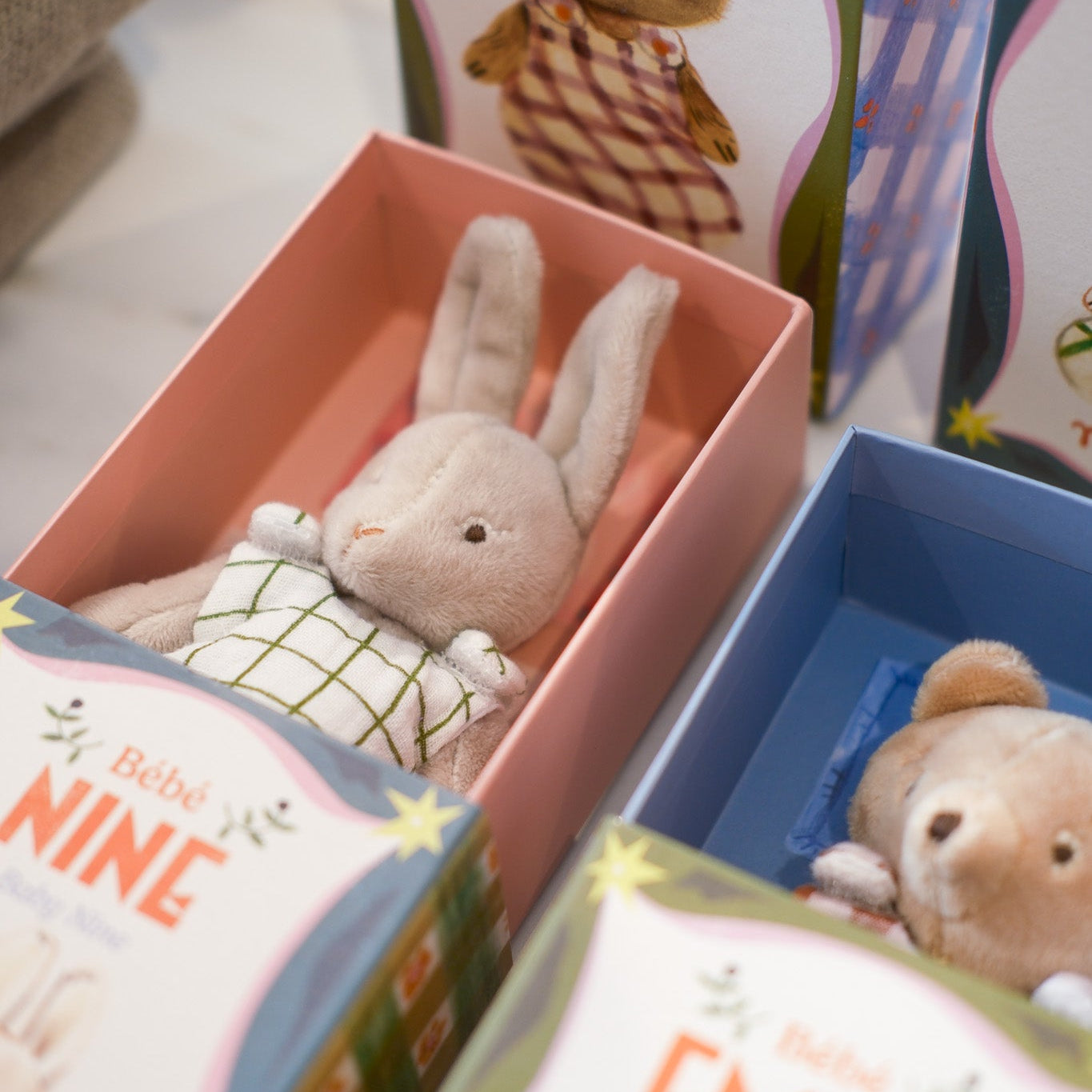 Plush toys with cute and vibrant french illustrations on packaging