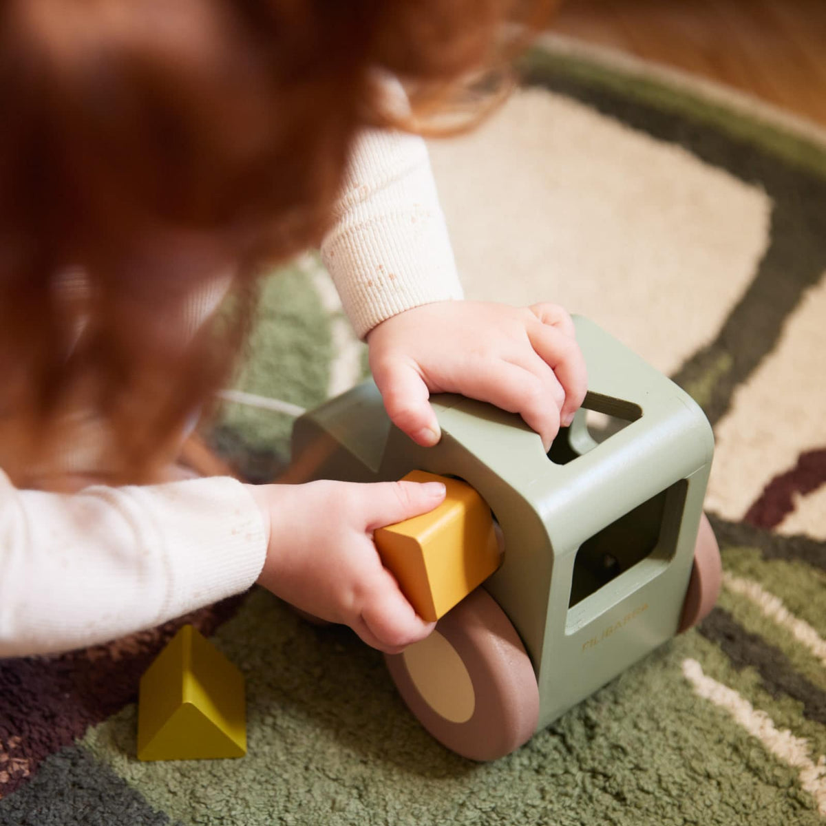 Pull along tractor with shape sorter