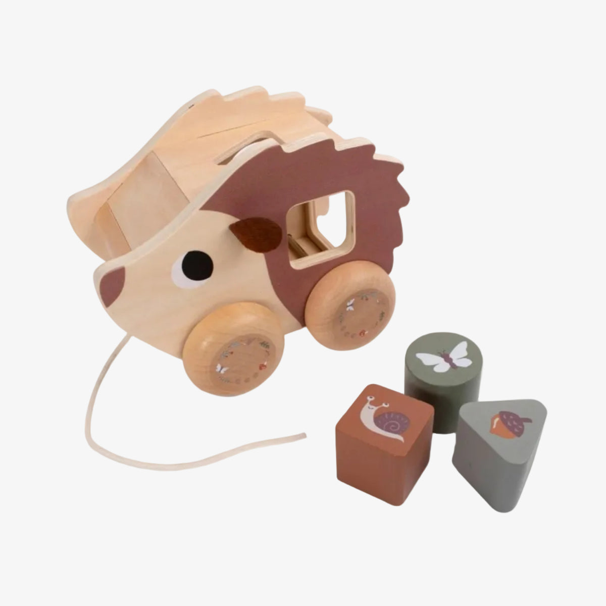 Wooden toy hedgehog with a string and three shape blocks on a white background