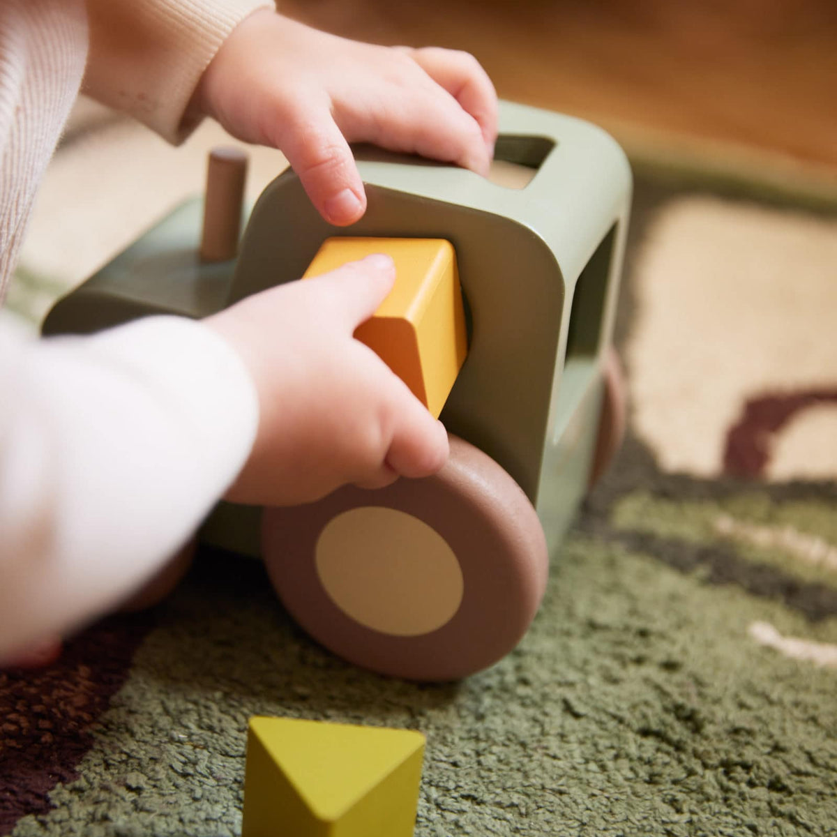 Pull along tractor with shape sorter
