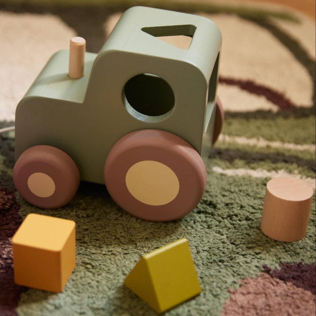 Pull along tractor with shape sorter