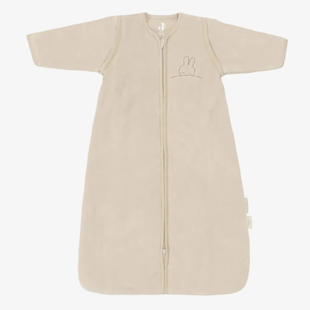Beige baby sleeping bag with a zipper on a white background