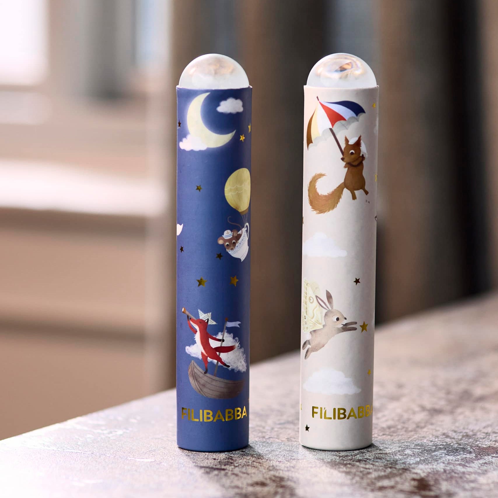 Two colorful vape devices with 'Filibar' branding on a marble surface.