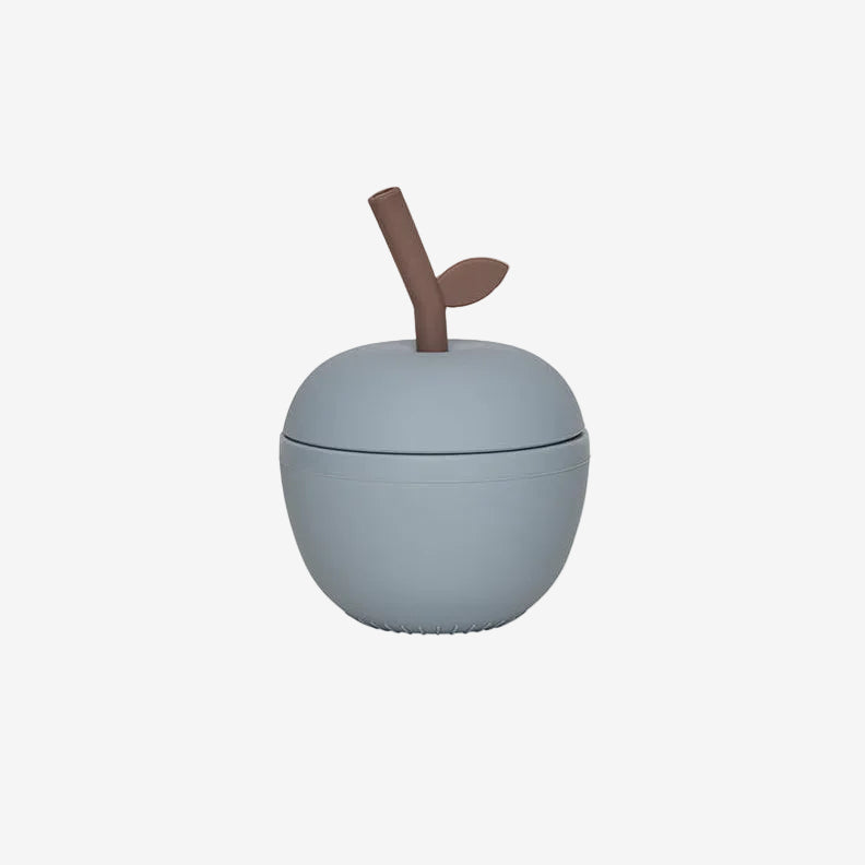 Small blue container with a brown handle on a light gray background