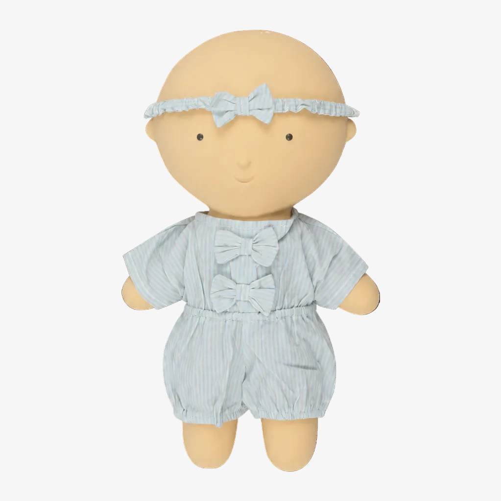 A soft fabric doll with a bald beige head and limbs, wearing a light blue and white striped short-sleeve romper with matching bow details and a matching headband, shown on a plain white background.