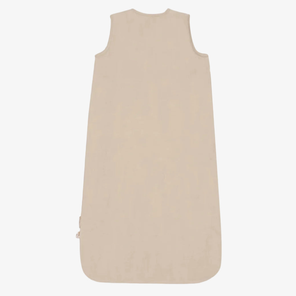 A sleeveless baby sleep sack in a light beige color, shown flat against a solid white background.