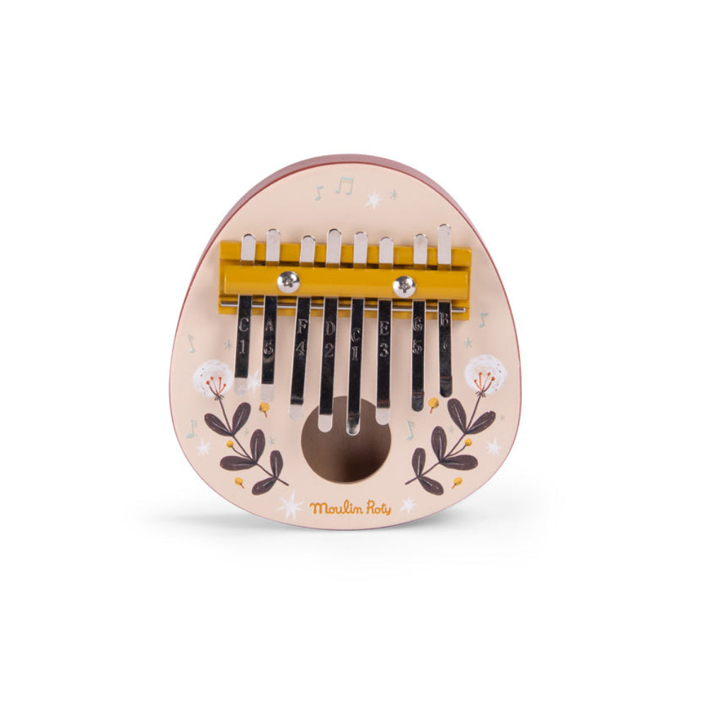 Small wooden kalimba with floral designs on a white background