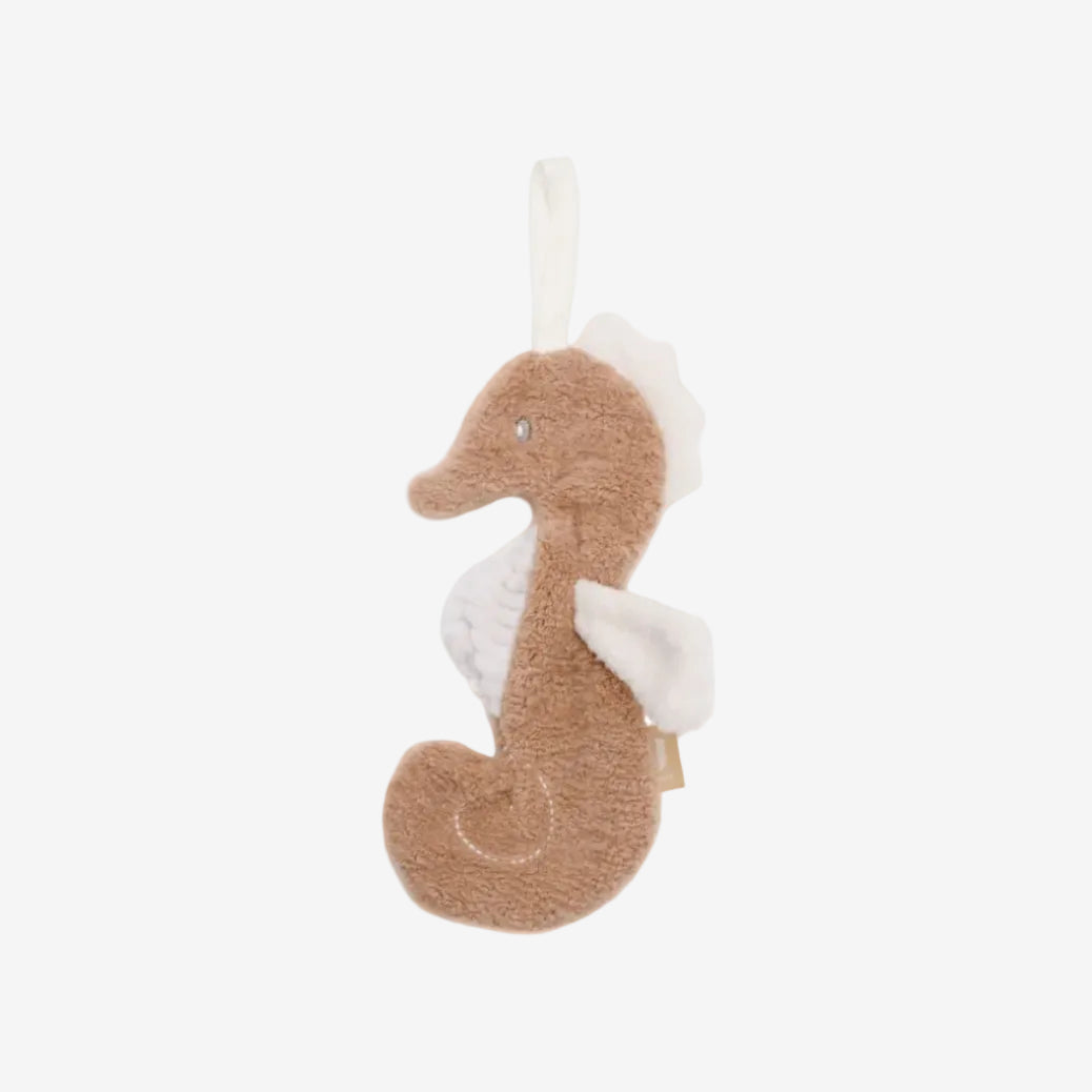 Plush seahorse toy on a white background