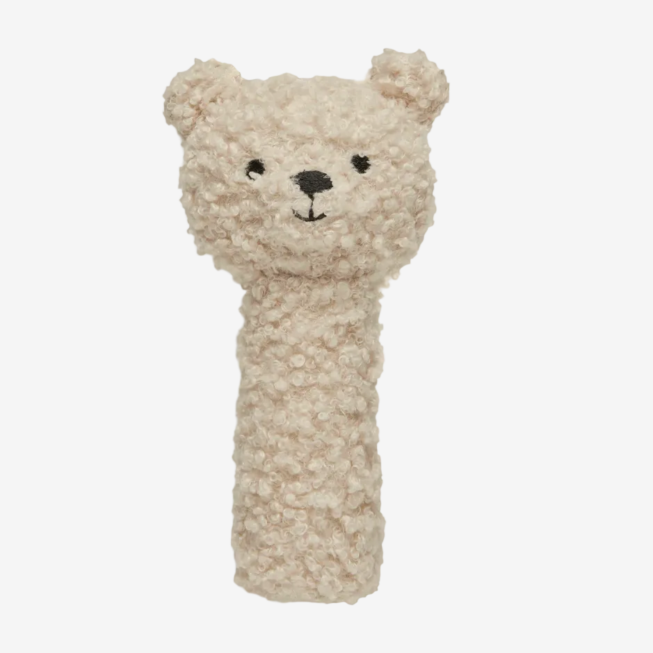 Plush teddy bear rattle on a white background